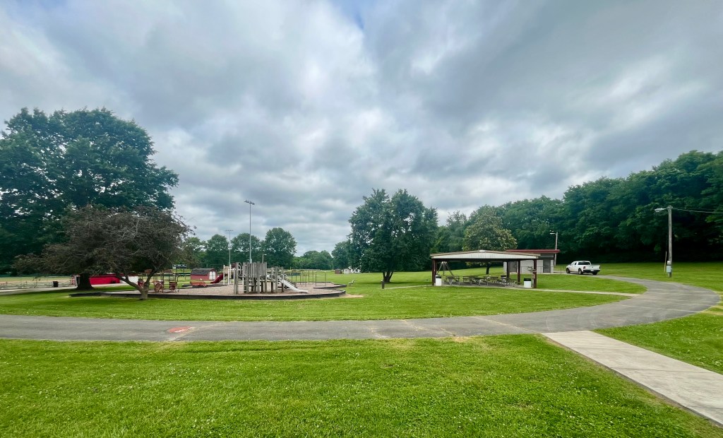 Playground, picnic pavilion, and paved walking loop at Hampshire Park in Hampshire Tennessee.